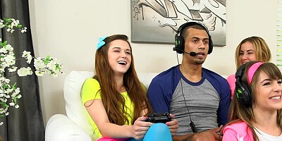 Three teen babes seduce a gamer and suck his huge dick